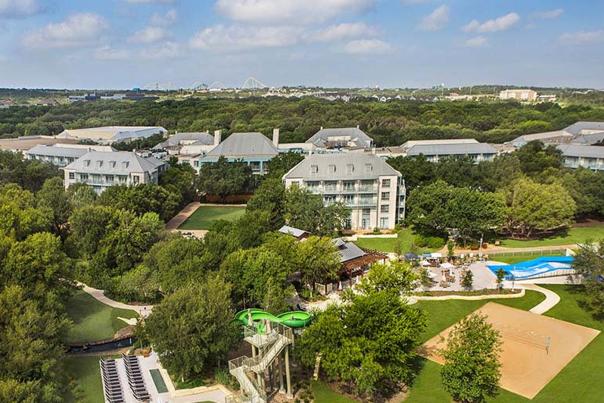 Bird's eye view of resort with trees.