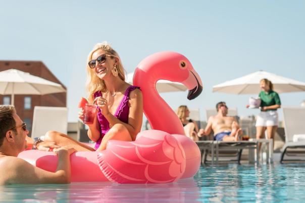 Man and woman at pool laughing