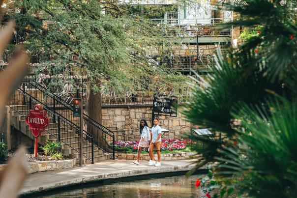 Couple strolling along River Walk