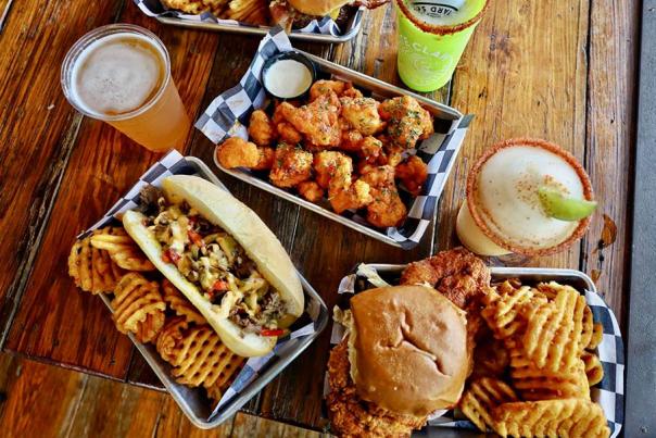 Overhead view of hamburger, fries, drinks