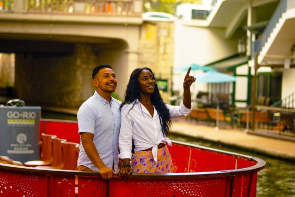 Couple on a Go Rio Barge on the River Walk smiling