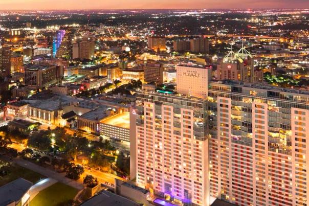 Overhead view of San Antonio sky lit up at night.