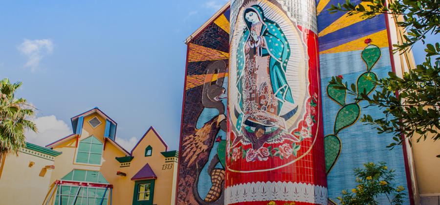 External view of Guadalupe Cultural Arts Center with veladora mural on side of building.