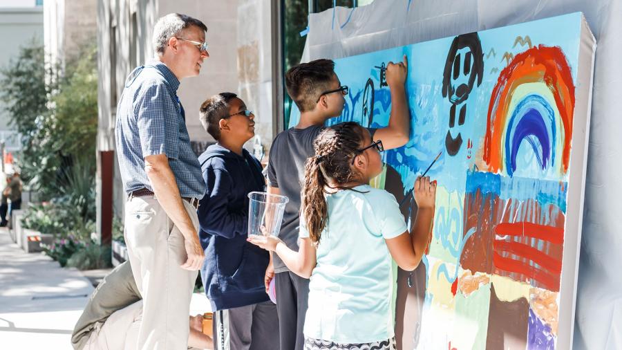Family painting at at Briscoe Western Art Museum