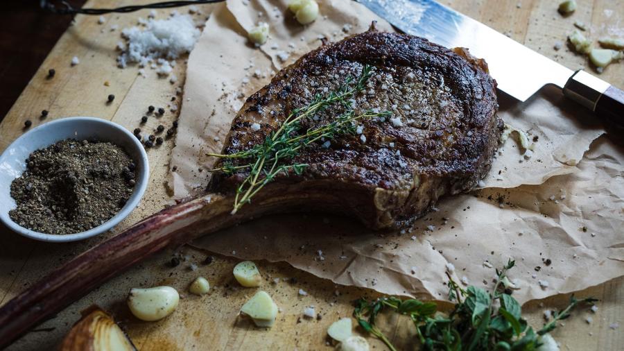 steak with seasonings and herbs