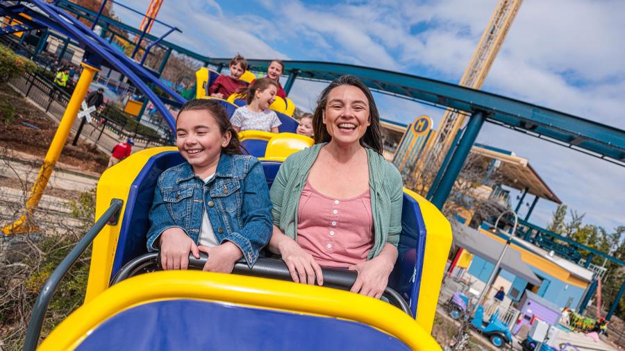 Mom and Daughter ridding a rollercoaster