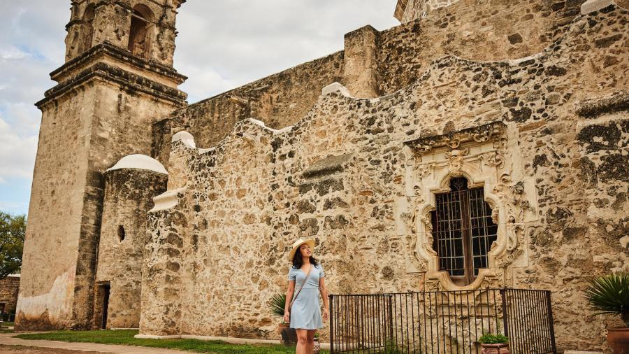 Woman walking through Mission San Jose in San Antonio Missions National Historical Park