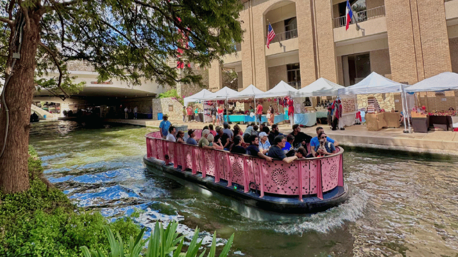 barge cruising by the River Walk artisan show