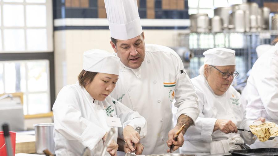 Chefs cooking together at Culinary Institute of America in San Antonio.
