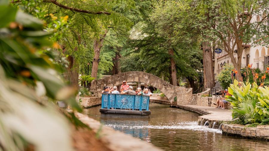 The San Antonio River Walk with a barge