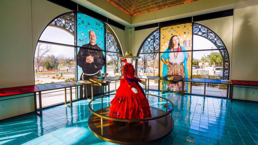 Interior view of World Heritage Center and mannequin in red dress.