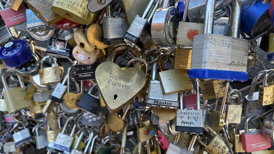 Padlocks with initials engraved and written on at San Antonio Love Lock Bridge.