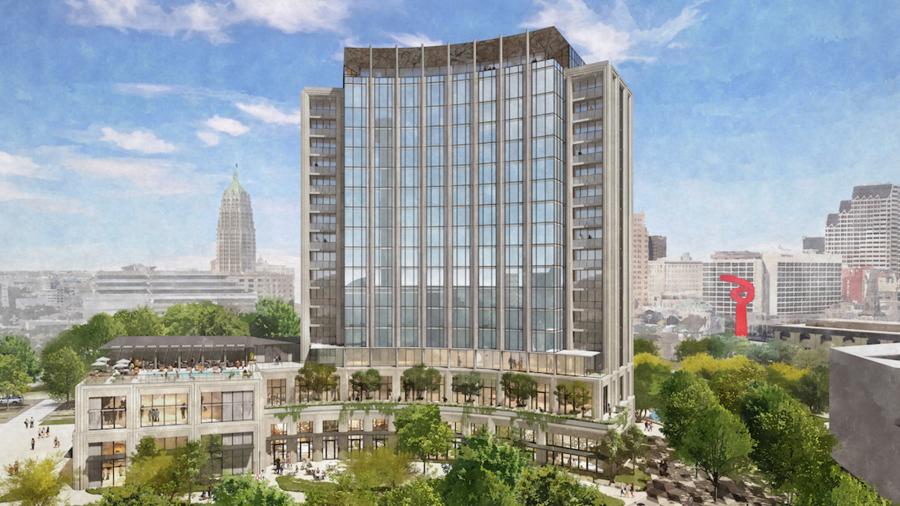 Rendering of exterior building of Monarch Hotel in San Antonio with skyline in background.