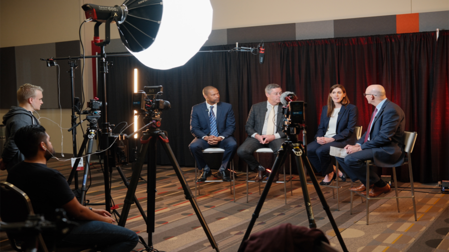businesspeople being recorded by crew