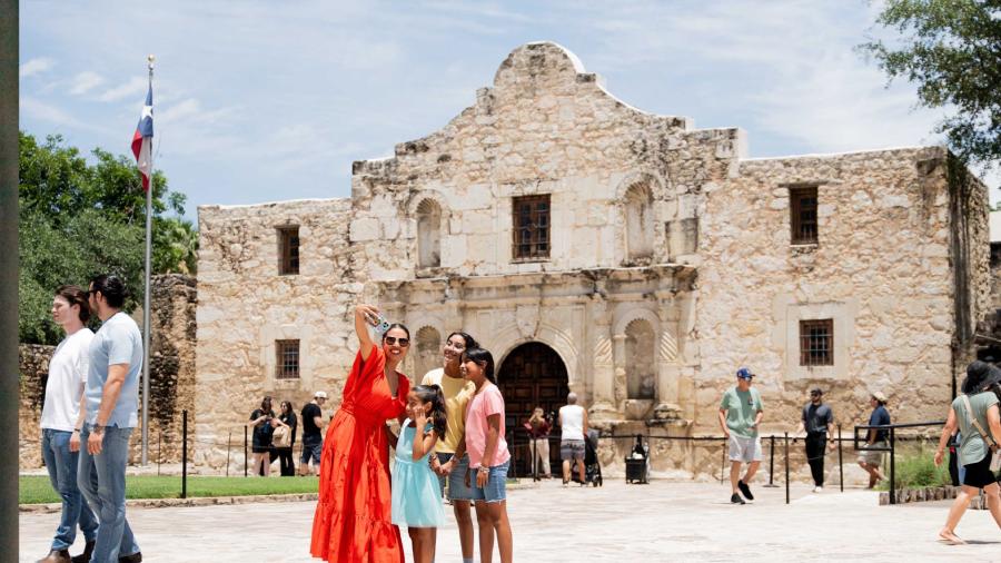 Family taking selfie at the Alamo.