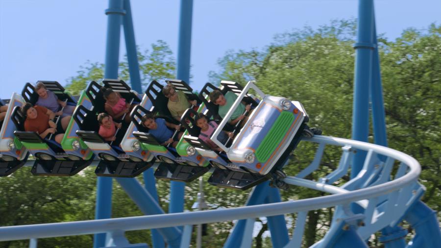 Kids on blue and green roller coaster at SeaWorld San Antonio.