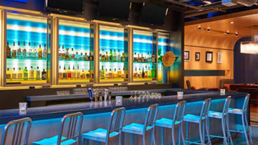 Hotel bar with empty chairs.