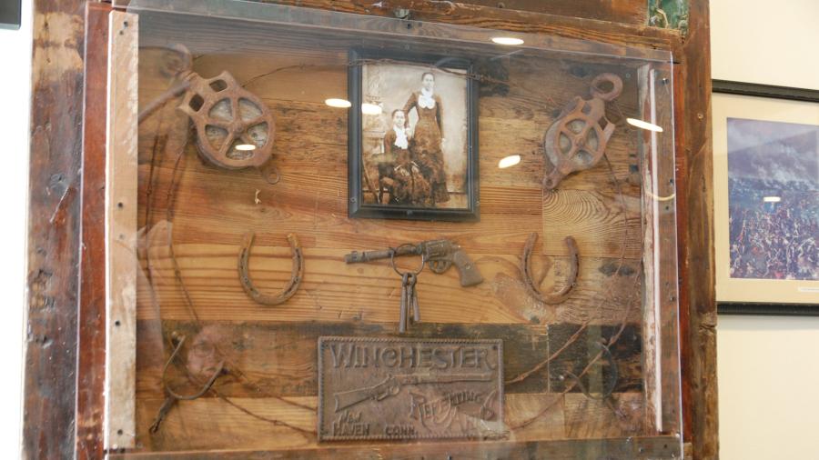 Display of artifacts with old-time photo