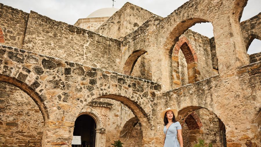 Woman walking through Mission San Jose in San Antonio Missions National Historical Park