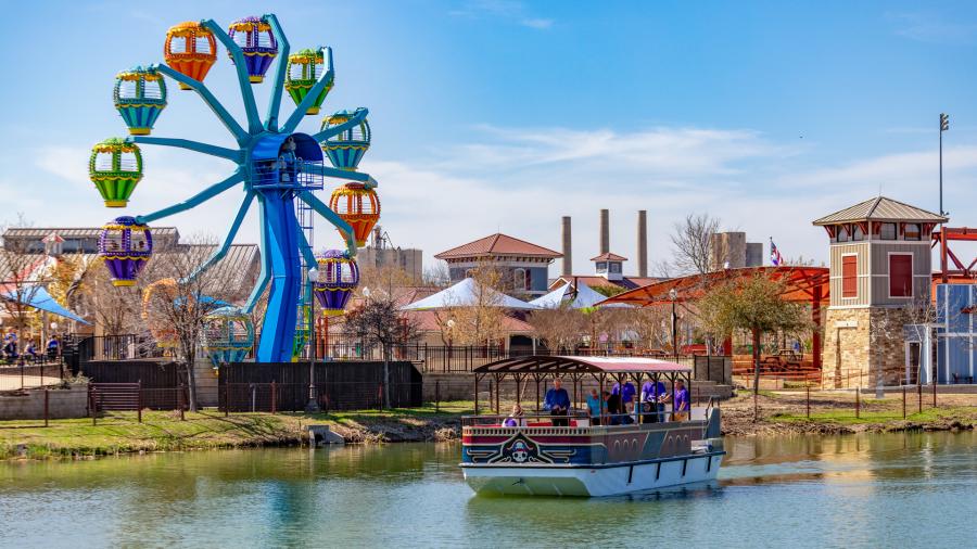 Overview of Morgan's Wonderland with ferris wheel and passenger boat
