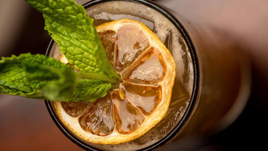 Adult beverage with greenery as garnish