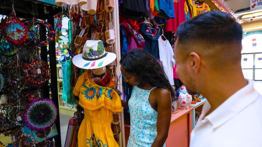 Man and woman shopping and looking at clothes