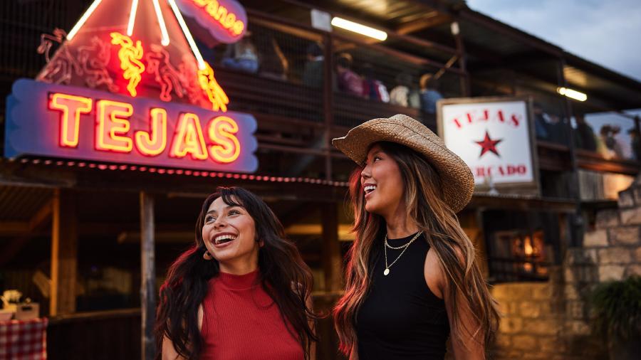 Two girls laughing at Tejas Rodeo in San Antonio