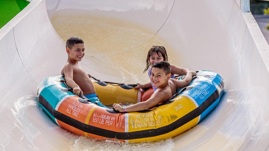 Three kids on inner tube ride
