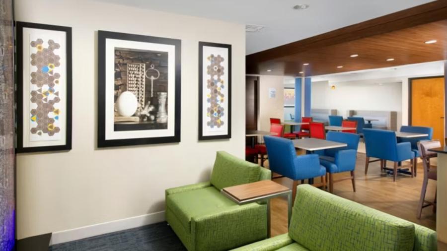 Colorful furniture in hotel lobby and wall art.