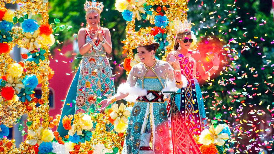 Girls on parade float surrounded by confetti