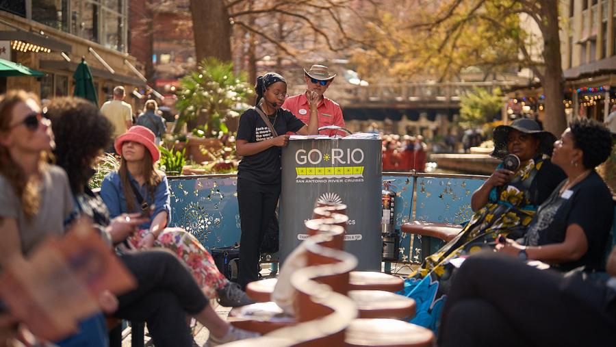 People gathering on Go Rio barge for Black History River Cruise
