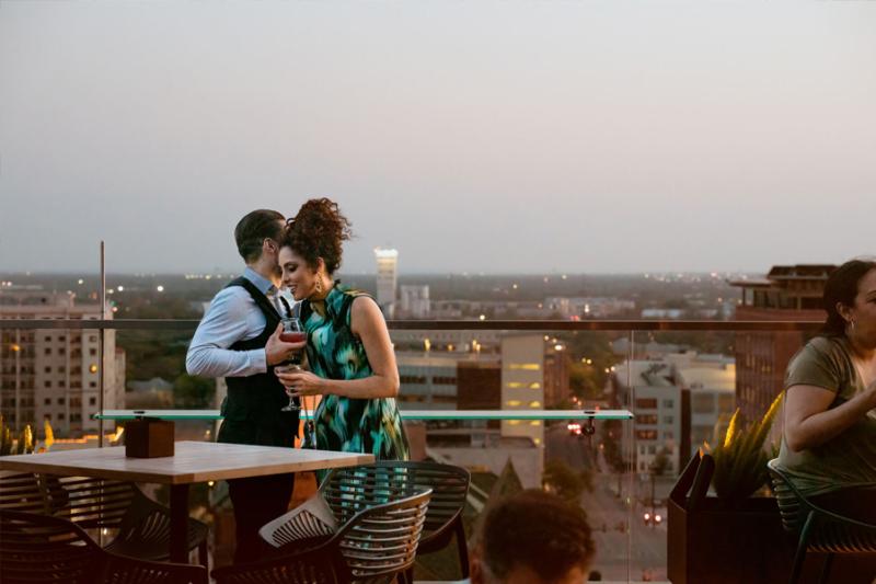 Couple on rooftop bar