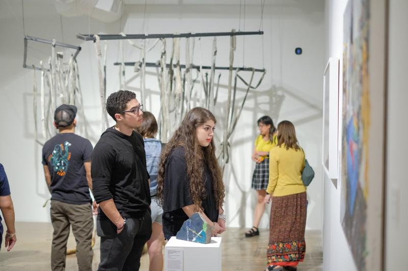 People observing art at the Contemporary at Blue Star
