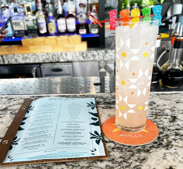 Tall glass with sour patch kids on top