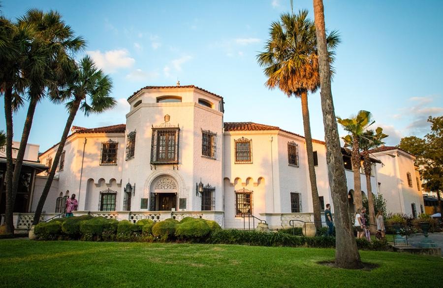 Exterior view of McNay Art Museum with palm trees