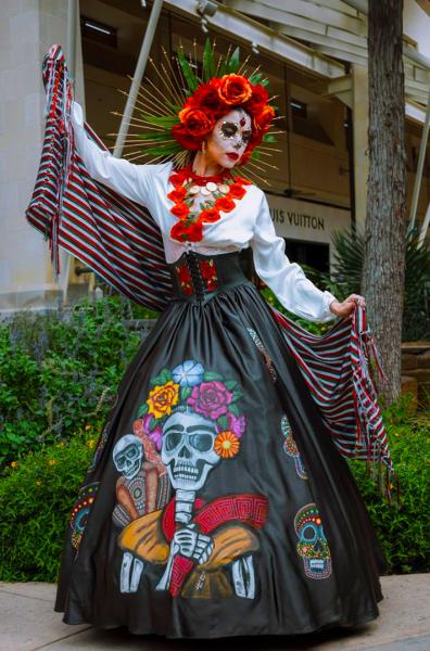 Woman dressed as a catrina at The Shops at River Center.