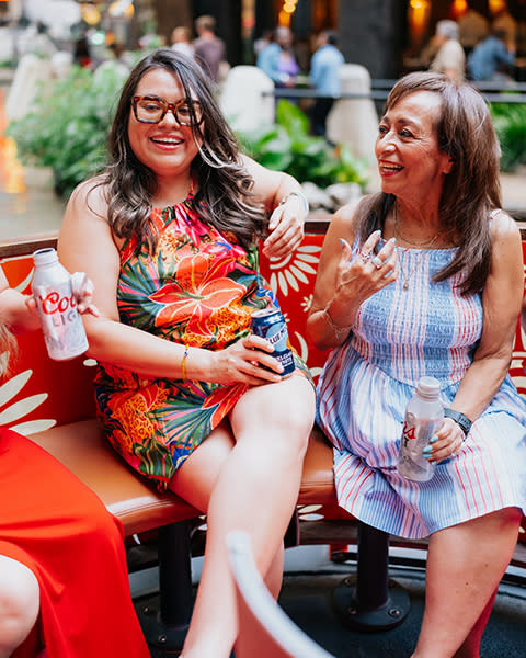 ladies enjoying a sip & cruise on a barge in San Antonio