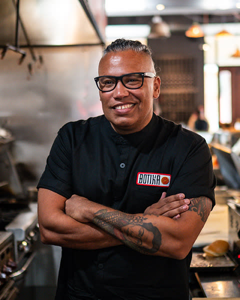Chef Lopez with arms folded