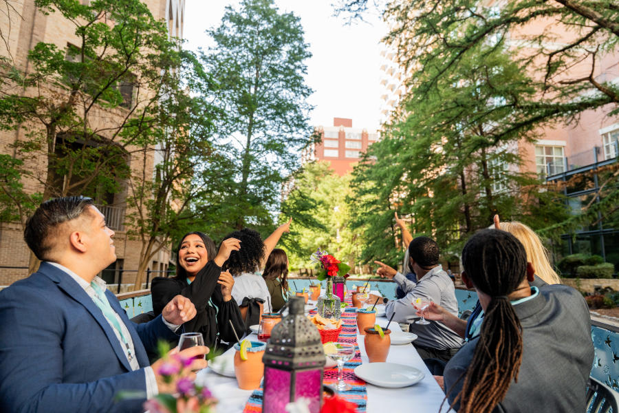 Group enjoying dinner on a river barge on the River Walk.