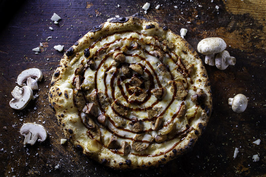 Fontina e Salsiccia Pizza with mushrooms at dough pizzeria