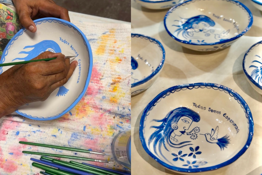 woman paining a ceramic bowl in an art studio