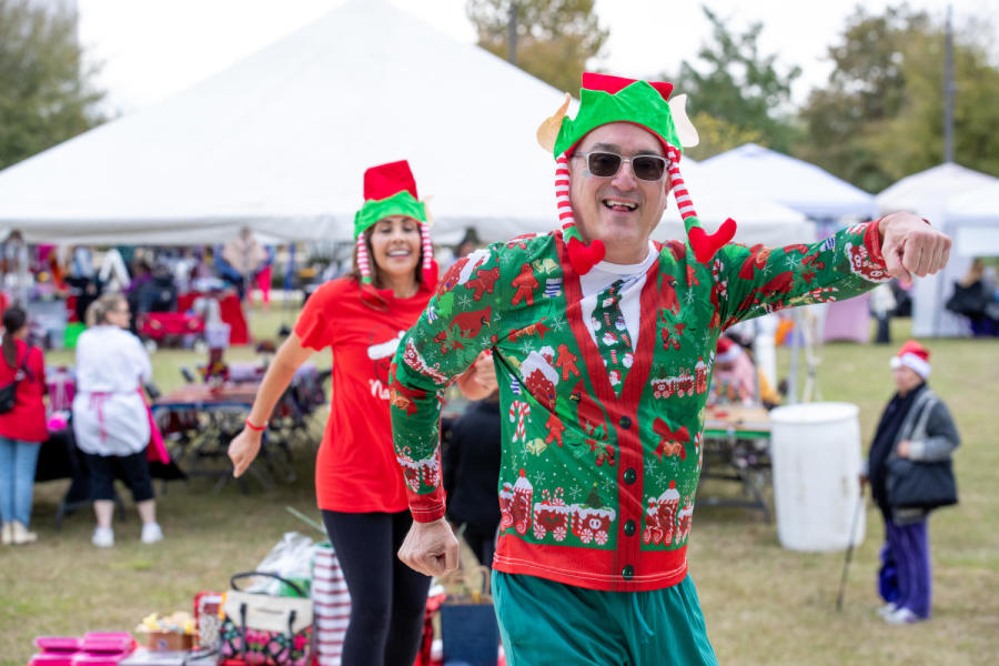 Man and woman in Christmas outfit at market