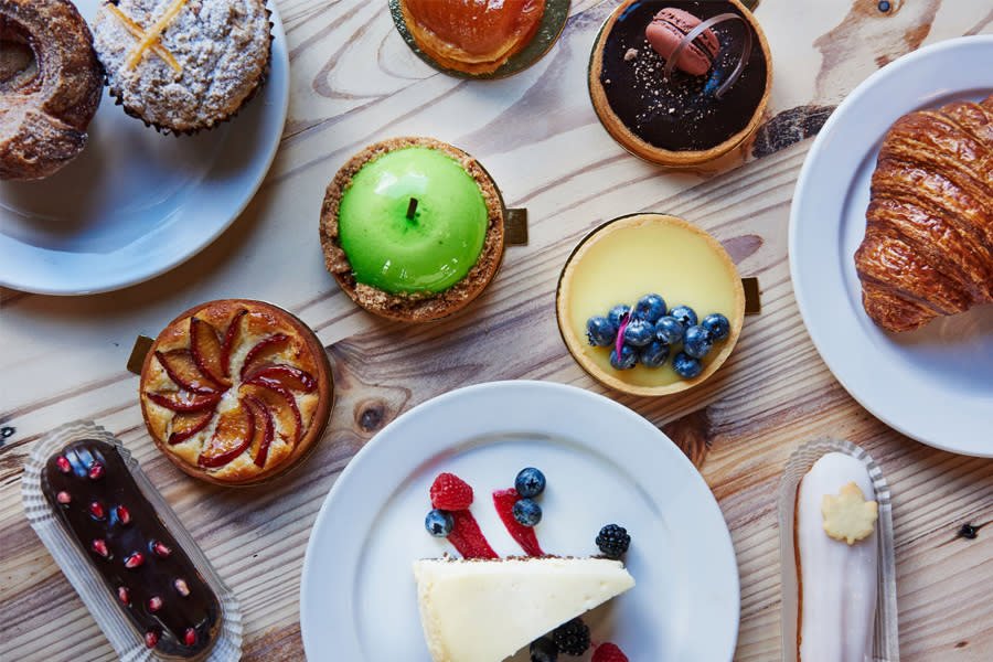 display of treats on a white wooden table from a view from above