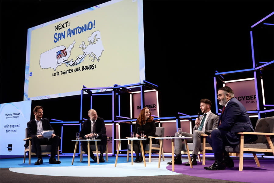 Group of people speaking on panel