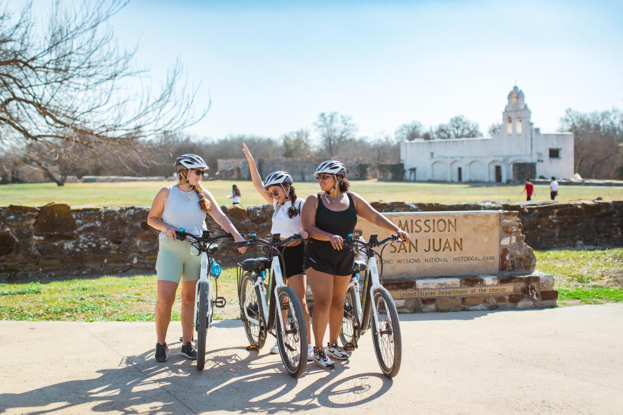 3 Friends with Bikes in front of Mission San Jose