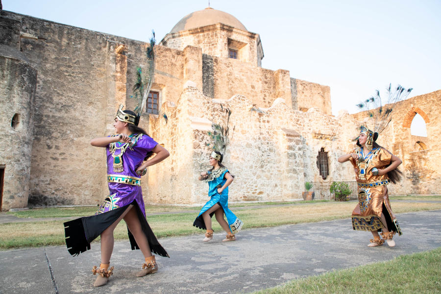 Performer smiling at San Antonio Missions National Historical Park.