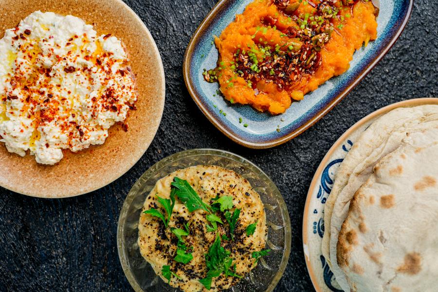 Overhead view of food including humus
