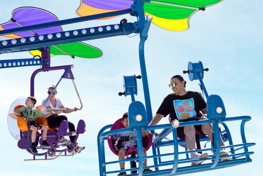 Riders on hang glide ride