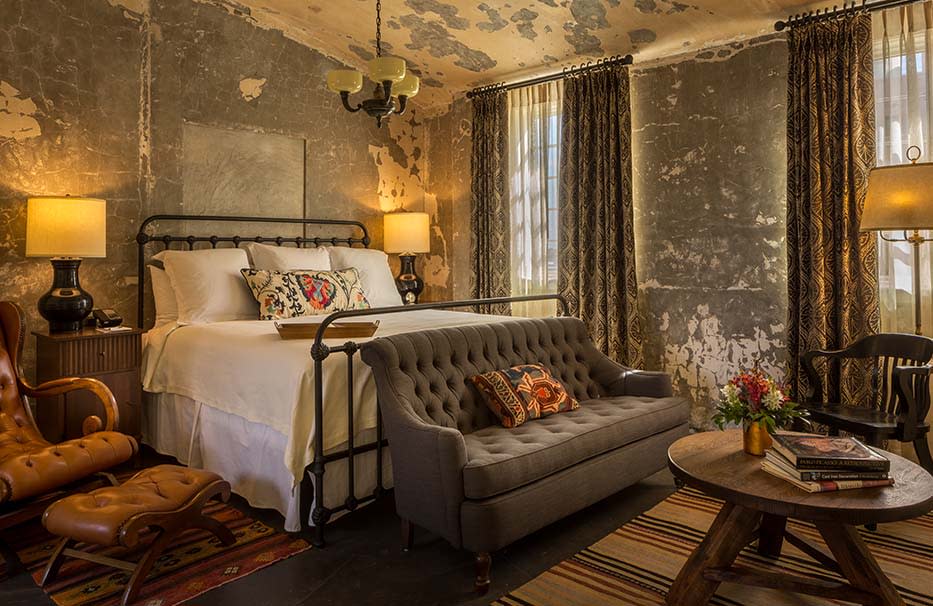 Boutique hotel room with iron frame bed