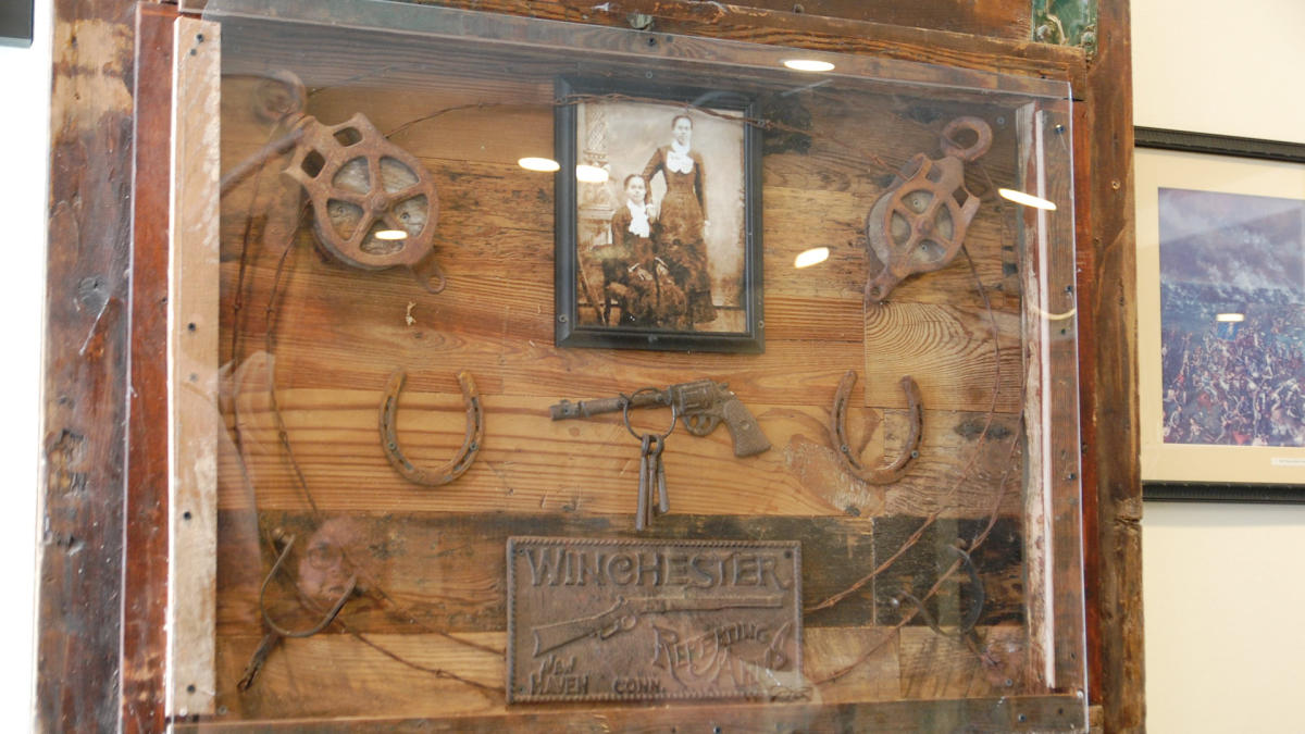 Display of artifacts with old-time photo
